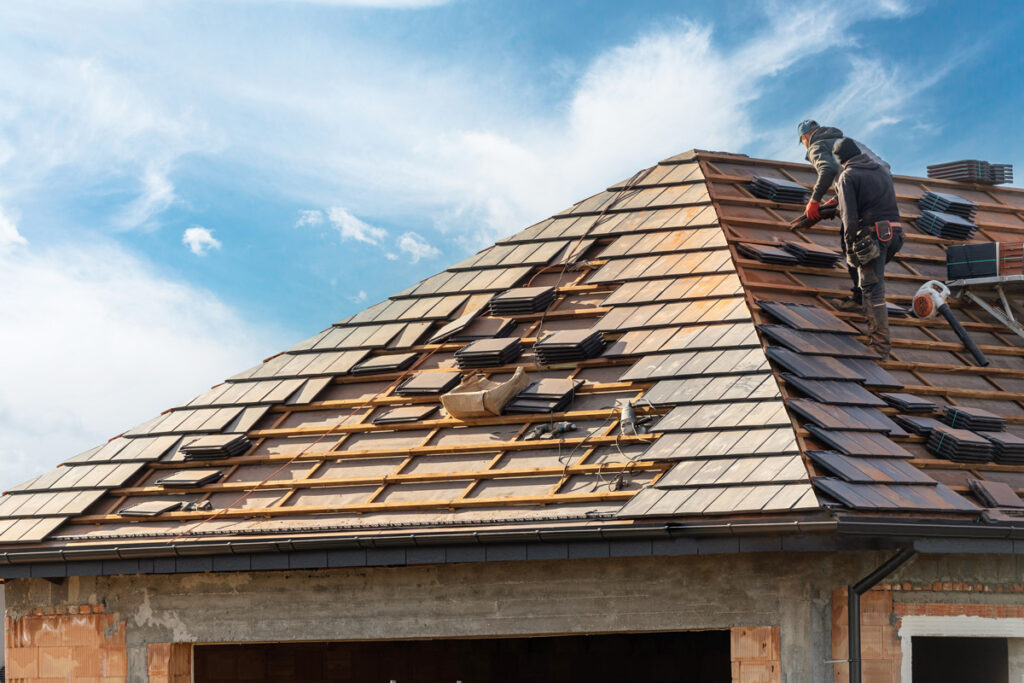 A man performing a roof replacement on a home in El Paso.